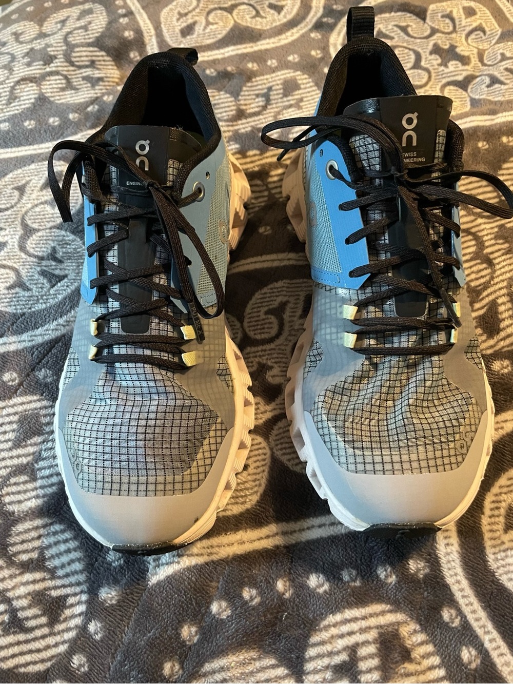 On Running women’s Trail Shoes in Light Blue and Gray